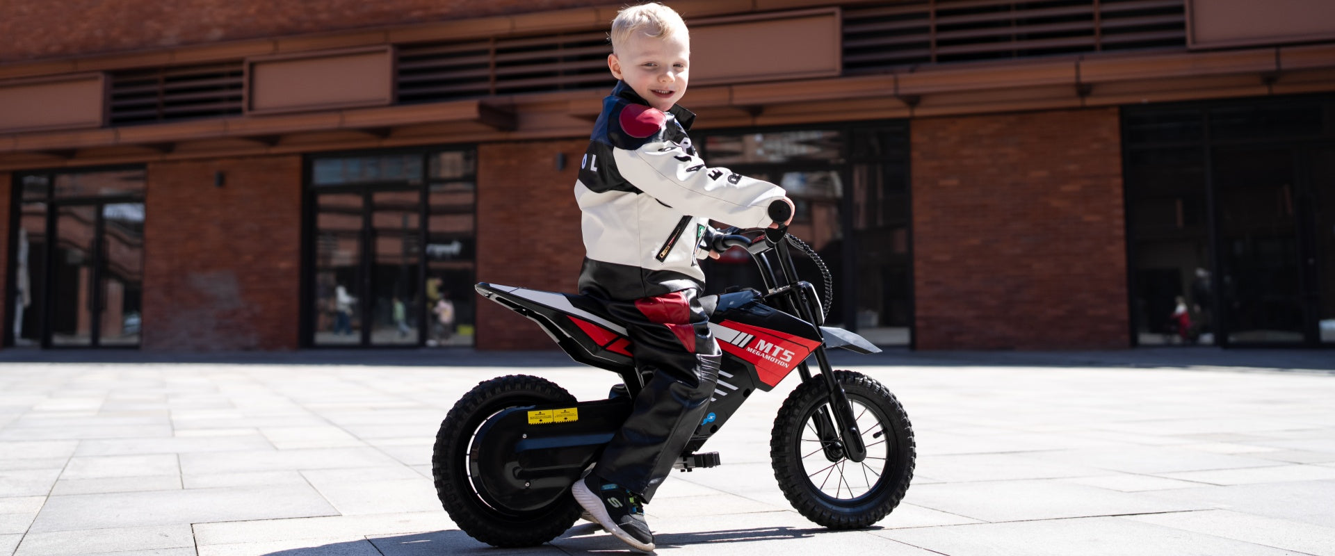 MEGA MOTION 2026 Children's Day Mega Sale official desktop hero banner. High-performance kids electric motorbikes and smart hoverboard with seat combos at up to 40% OFF with fast local European warehouse shipping.