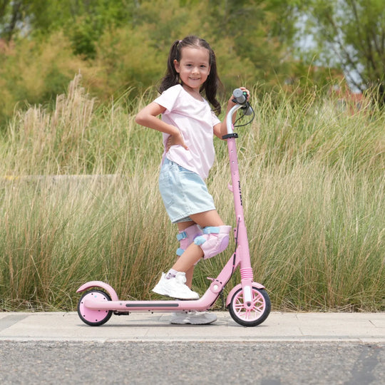 Image of a girl riding a pink MEGA MOTION ME1 electric scooter
