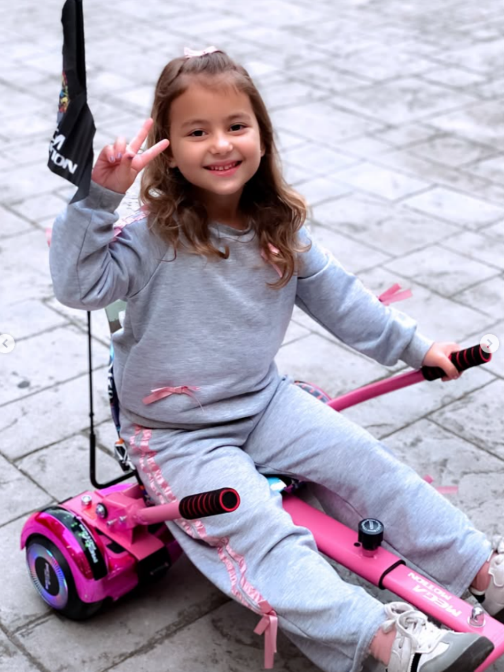 Images of a little girl riding an A03 hoverboard and go-kart